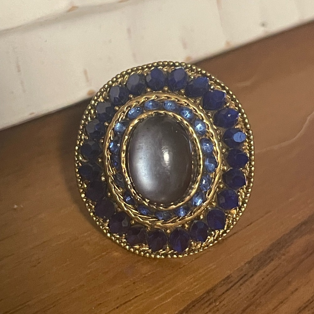 Blue cocktail ring with gold color detailing
